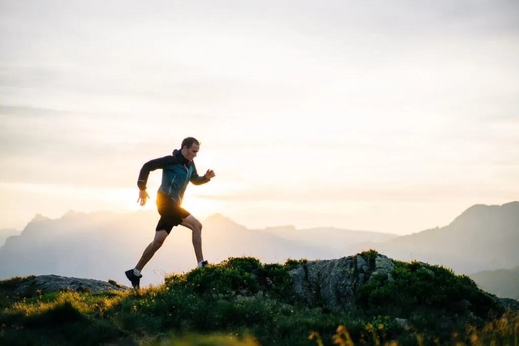 man run up to mountain